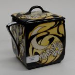 A Moorcroft design trail twin handled biscuit box with cover,