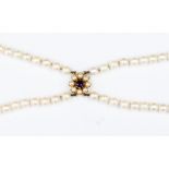 A double row choker necklace of cultured pearls,