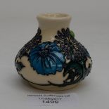 A Moorcroft miniature vase in the daisy pattern, 1st quality, in unusual colourway,