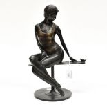 20th Century School bronze of a seated woman in bathing costume