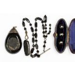 A collection of Whitby Jet, including watch chains,