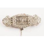 A 1920s platinum and diamond brooch converted from a wristwatch,