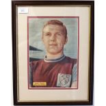 Autograph: A signed Bobby Moore poster within a frame.