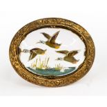 A Victorian gilt metal Essex crystal brooch with three Mallards flying over a lake