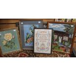 A collection of four various woolwork pictures depicting flowers, a cottage scene,