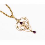A Edwardian 9ct gold pendant set with amethyst and seed pearls,