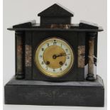 A slate mantle clock, with marble pillars, Arabic numerals,