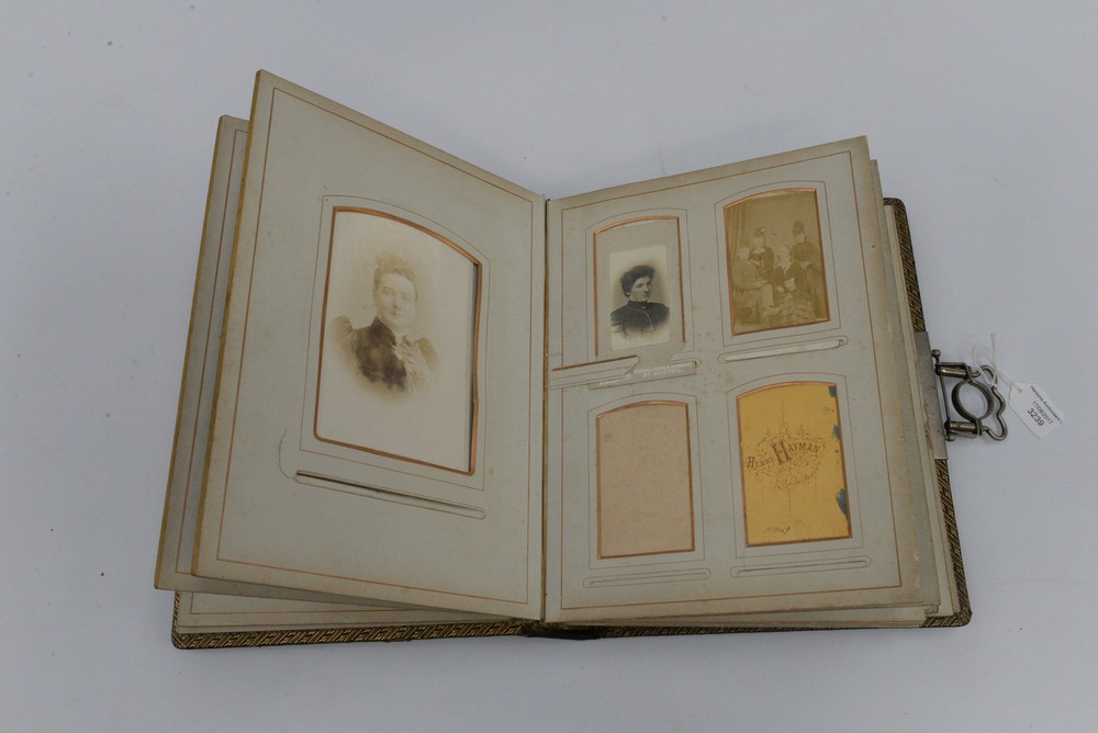 A Victorian photograph album with some photographs
