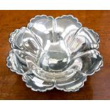 A 20th century silver raised dish, Atkin Borthers Sheffield 1945, petal form waved border,