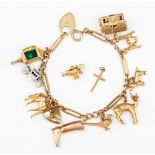 A 9ct gold charm bracelet with eleven gold charms, (two loose) including a horse,