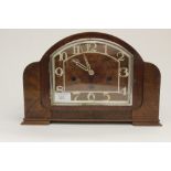 A 1930s Art Deco Walnut veneered , eight day mantle clock, having a Westminster chime,