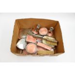 A box containing a collection of assorted dressing table sets, mostly Art Deco,