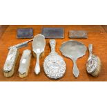 A Victoria silver mounted four piece dressing table set, embossed leafage scrolls,