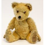 Chiltern: A 1930's/40's golden mohair teddy bear, possibly Chiltern, orange glass eyes,