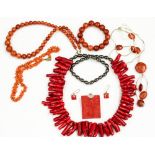 A collection of coral necklaces, to include a rectangular coral and silver pendant,