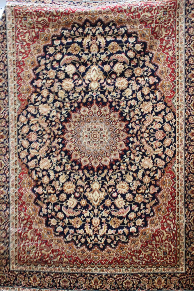 A Keshan blue ground carpet,