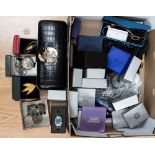 A box containing an assorted collection of costume jewellery including boxed watches, chains,