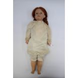 Diamond Pottery Company: A D.P.C. closed mouth, bisque head doll, marked to back of neck 'D.P.C.
