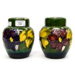 Two Moorcroft ginger jars, 'clematis' pattern on green ground, both being initialed WM to base,