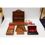 Assorted items to include stationary shelves, rolling rule, silver cross pen set,