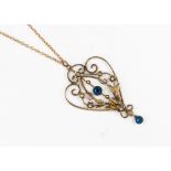 An Edwardian 9ct pearl and blue stone pendant, set with two blue stones and seed pearls,