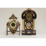 Two ceramic time pieces: one having ormolu frame and majolica Scottish theme,