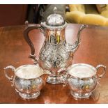 A collection of silver plate including a Victoria style coffee pot,