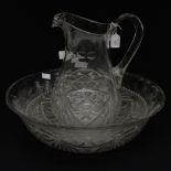 A cut glass toilet jug and bowl,