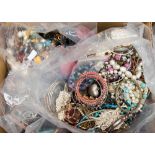 Four bags of assorted costume jewellery