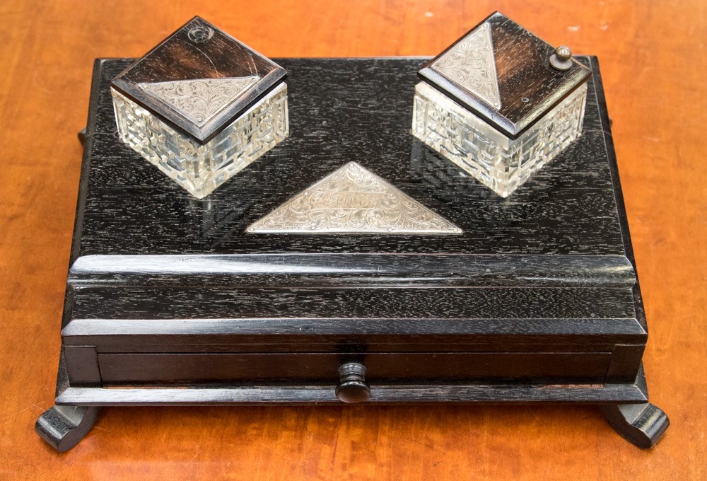 A desk set with drawer, with silver initialed cartouche and silver topped inkwell lids,