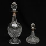 Two silver topped cut glass decanters