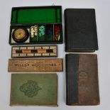 Two cribbage boards, one with parquetry, together with a vintage travelling roulette game,