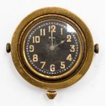 A 1920s-30s car clock - with brass surround and black dial.