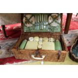 A Brexton vintage picnic hamper/set, including six ceramic cups, saucers and sandwich plates,
