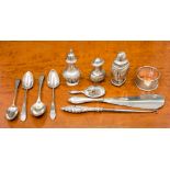 A group of silver and white metal items to include pepper pots, napkin ring, scrap, etc,