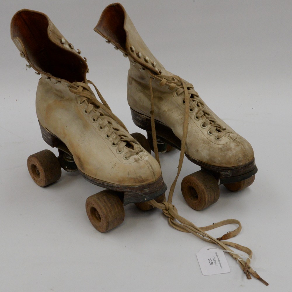 A pair of vintage Roller skates (leather) white boots with utility mark 1941,