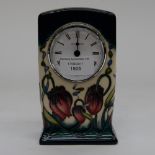 A Moorcroft Trial clock, 1st quality, red pasque flowers on green and cream ground,