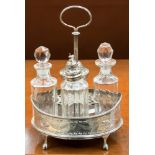 A silver cruet set on silver stand,