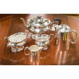 A silver plated three piece tea service and milk jug and hot water jug (5)