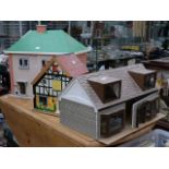 A small cardboard dolls house, with furnishings, another small dolls house,