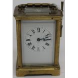 Brass carriage clock, white enamel face,