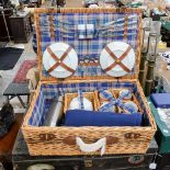 A modern boxed wickerwork picnic basket and contents