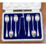 A cased set of silver teaspoons, with matching nips, weighing approx 3.