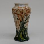 A Moorcroft vase in the Lily pattern, 1st quality, orange lillies on cream ground,