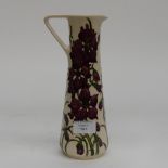 A Moorcroft pitcher in the Delphinium pattern, 1st quality in unusual colourway,