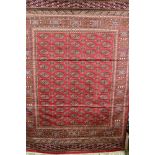 A Bokhara red ground carpet,