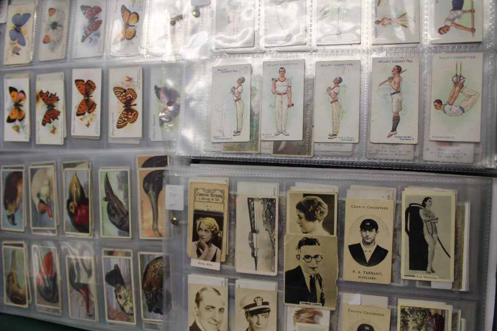 A box and tub containing a large quantity of cigarette cards, Carreras, Black Cat, Wills's,