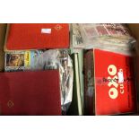 Cardboard box, accumulation of stamps in tins, packets and four small stock books,