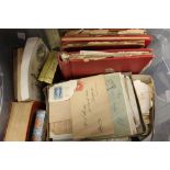 A small plastic tub containing an untidy accumulation of stamps,