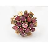 A 9ct pink tourmaline cluster style ring with gold bar details (centre stone replaced with crystal),